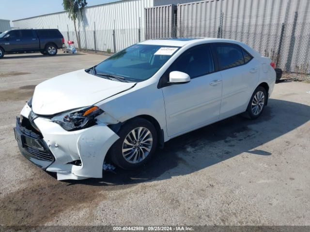 Photo 1 VIN: 5YFBURHE0KP868901 - TOYOTA COROLLA 