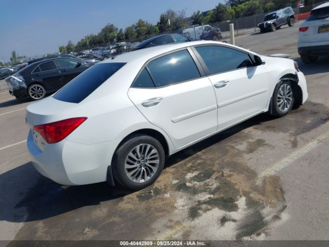 Photo 3 VIN: 5YFBURHE0KP868901 - TOYOTA COROLLA 