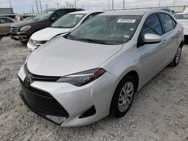 Photo 1 VIN: 5YFBURHE0KP876769 - TOYOTA COROLLA L 