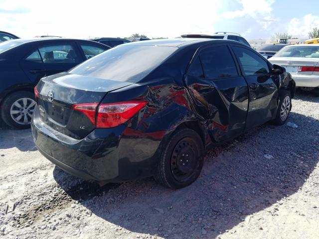 Photo 3 VIN: 5YFBURHE0KP879011 - TOYOTA COROLLA L 