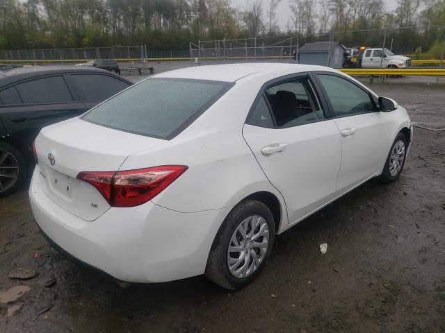 Photo 3 VIN: 5YFBURHE0KP888310 - TOYOTA COROLLA L 