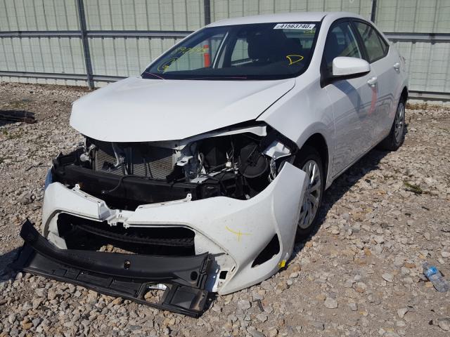 Photo 1 VIN: 5YFBURHE0KP890543 - TOYOTA COROLLA L 