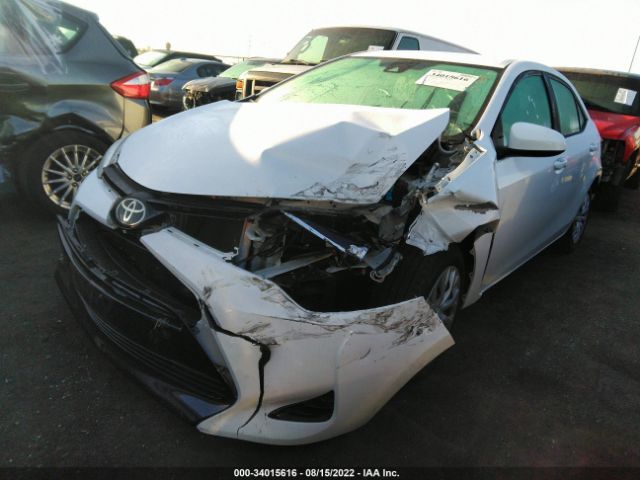 Photo 1 VIN: 5YFBURHE0KP893877 - TOYOTA COROLLA 