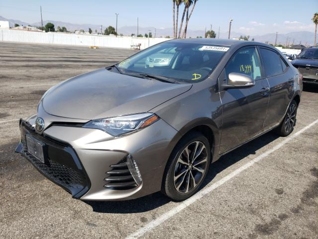 Photo 1 VIN: 5YFBURHE0KP894785 - TOYOTA COROLLA L 