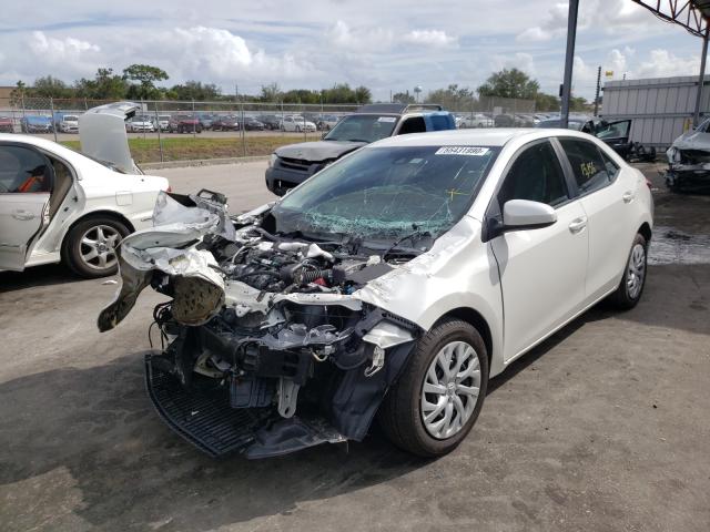 Photo 1 VIN: 5YFBURHE0KP897881 - TOYOTA COROLLA L 