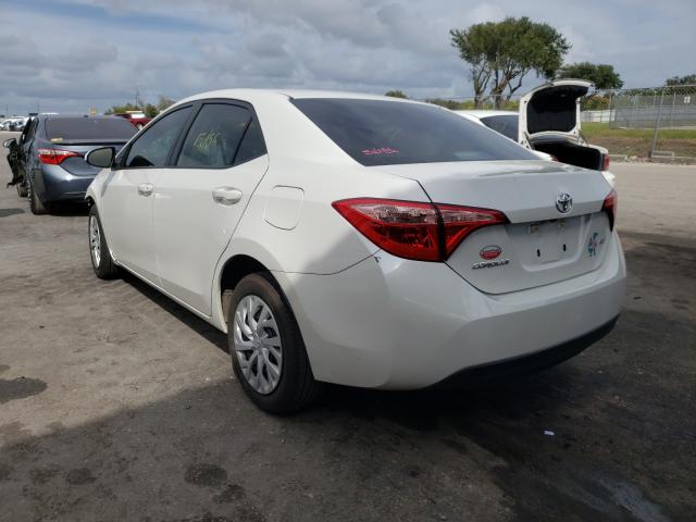 Photo 2 VIN: 5YFBURHE0KP897881 - TOYOTA COROLLA L 