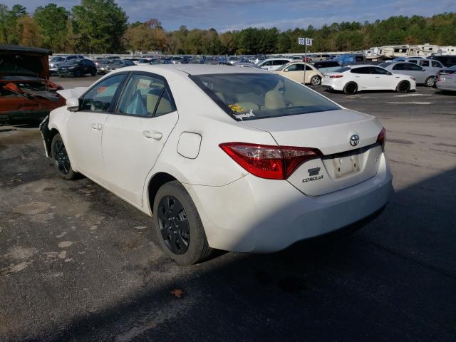 Photo 2 VIN: 5YFBURHE1HP668456 - TOYOTA COROLLA L 