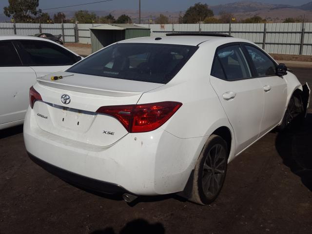 Photo 3 VIN: 5YFBURHE1HP692983 - TOYOTA COROLLA L 