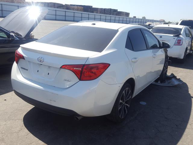 Photo 3 VIN: 5YFBURHE1HP701682 - TOYOTA COROLLA L 