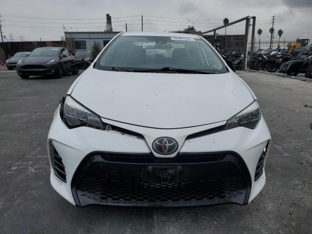 Photo 4 VIN: 5YFBURHE1KP878997 - TOYOTA COROLLA L 