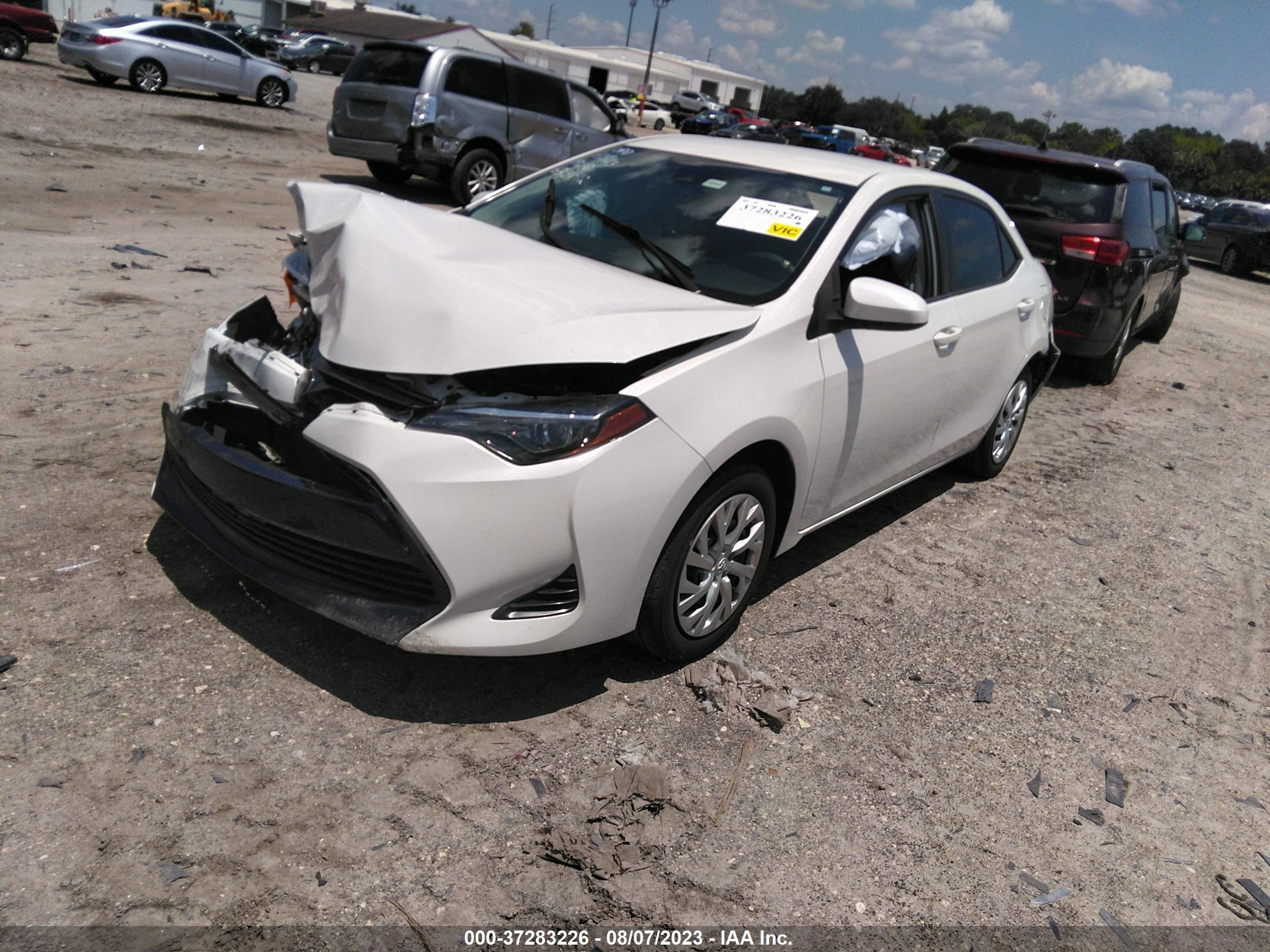 Photo 1 VIN: 5YFBURHE1KP903381 - TOYOTA COROLLA 