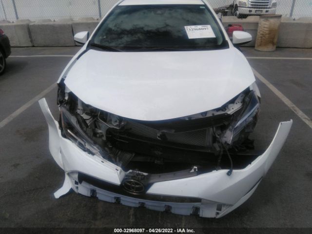 Photo 5 VIN: 5YFBURHE1KP904787 - TOYOTA COROLLA 