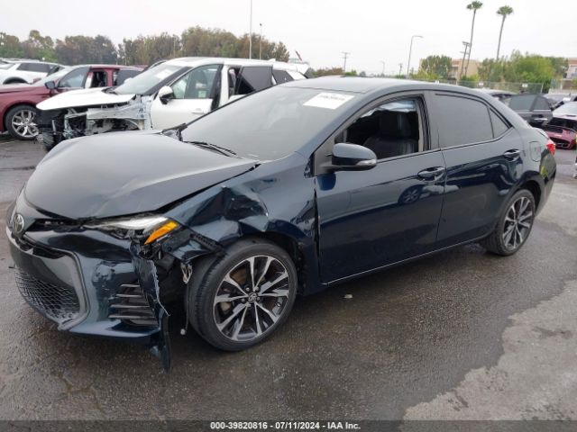 Photo 1 VIN: 5YFBURHE1KP906104 - TOYOTA COROLLA 