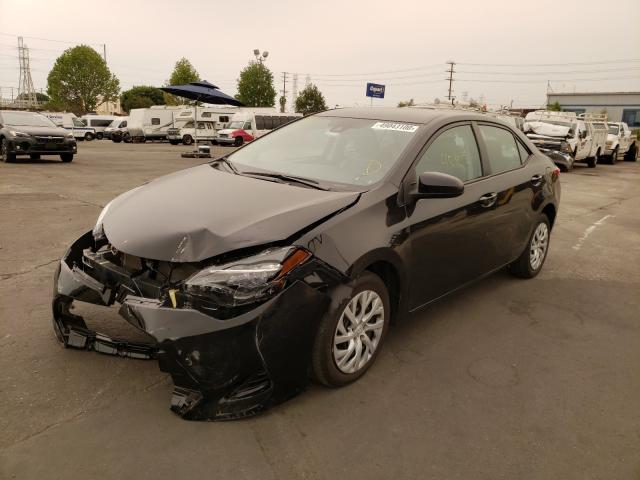 Photo 1 VIN: 5YFBURHE2JP750086 - TOYOTA COROLLA L 