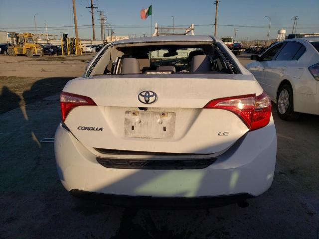 Photo 5 VIN: 5YFBURHE2JP799031 - TOYOTA COROLLA L 