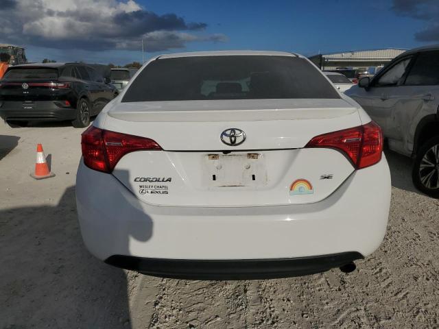 Photo 5 VIN: 5YFBURHE2JP824509 - TOYOTA COROLLA L 