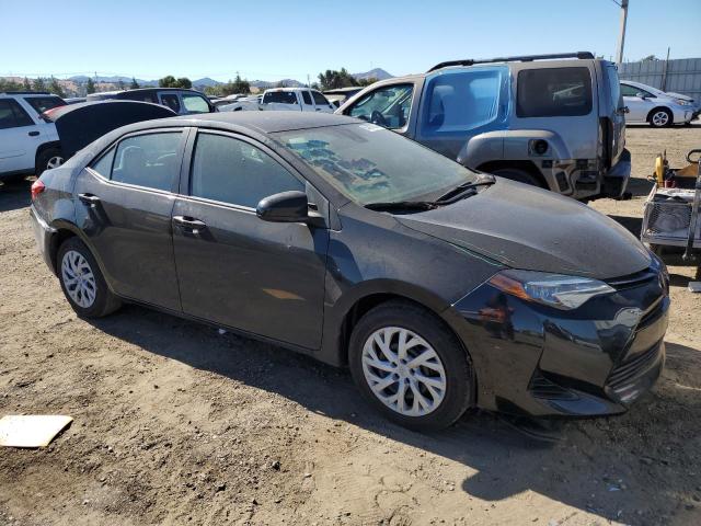 Photo 3 VIN: 5YFBURHE2KP881293 - TOYOTA COROLLA L 