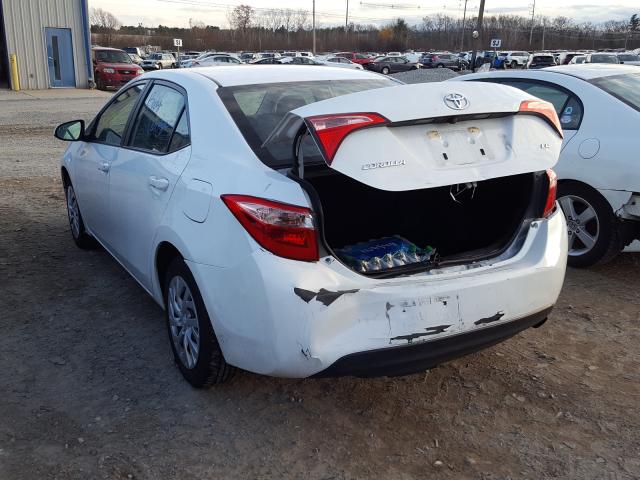 Photo 2 VIN: 5YFBURHE2KP896859 - TOYOTA COROLLA L 