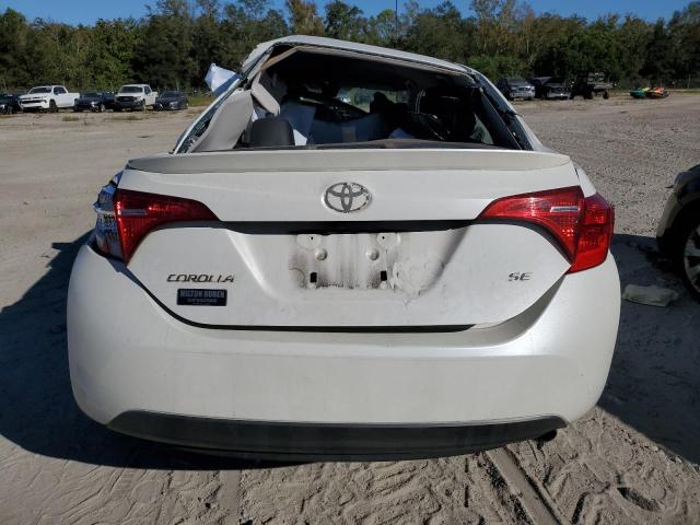 Photo 5 VIN: 5YFBURHE2KP945865 - TOYOTA COROLLA L 