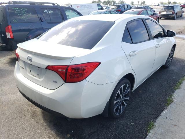 Photo 3 VIN: 5YFBURHE3HP640934 - TOYOTA COROLLA L 