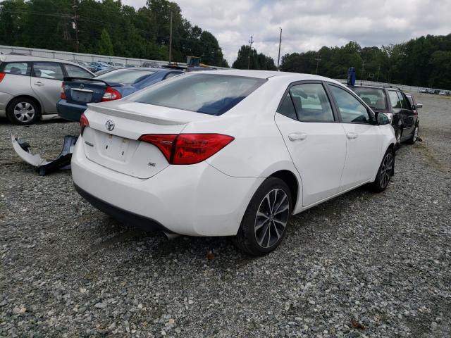 Photo 3 VIN: 5YFBURHE3HP668684 - TOYOTA COROLLA L 