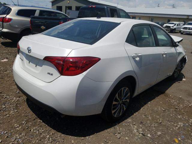 Photo 3 VIN: 5YFBURHE3HP693343 - TOYOTA COROLLA L 