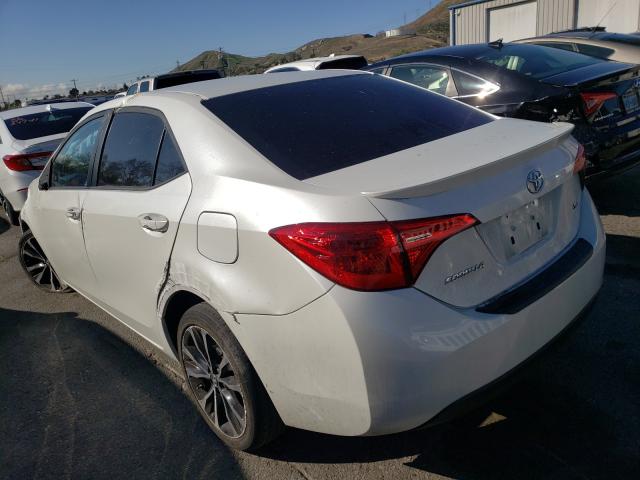 Photo 2 VIN: 5YFBURHE3HP724610 - TOYOTA COROLLA L 