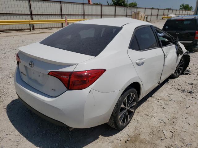 Photo 3 VIN: 5YFBURHE3JP793948 - TOYOTA COROLLA L 