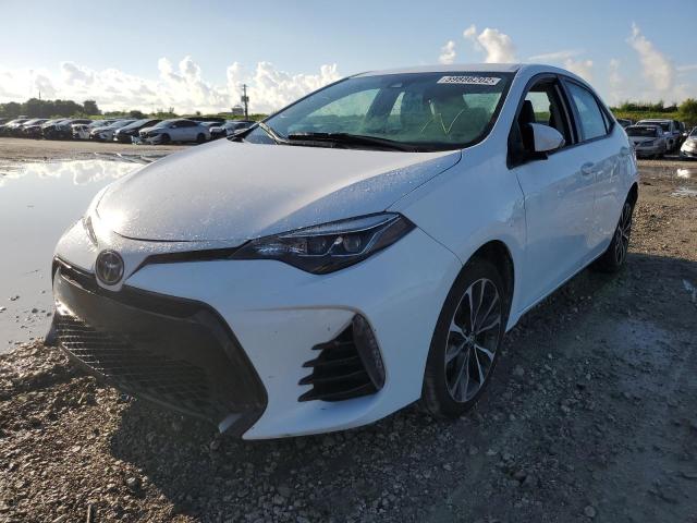 Photo 1 VIN: 5YFBURHE3JP843697 - TOYOTA COROLLA SE 