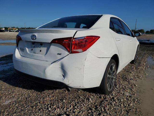 Photo 3 VIN: 5YFBURHE3JP843697 - TOYOTA COROLLA SE 