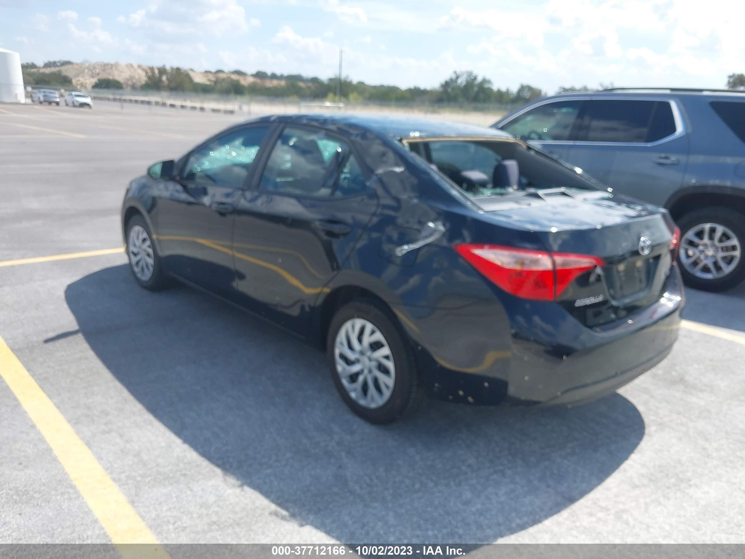 Photo 2 VIN: 5YFBURHE3KP874885 - TOYOTA COROLLA 