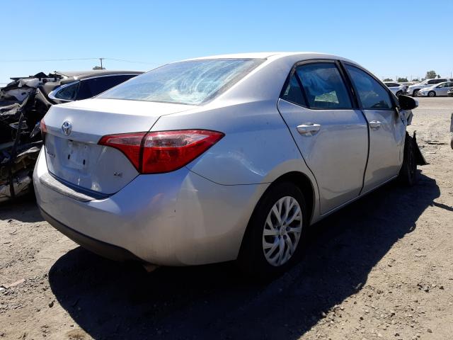 Photo 3 VIN: 5YFBURHE3KP879570 - TOYOTA COROLLA L 