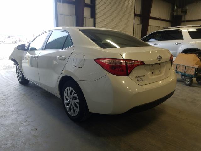 Photo 2 VIN: 5YFBURHE3KP886096 - TOYOTA COROLLA L 