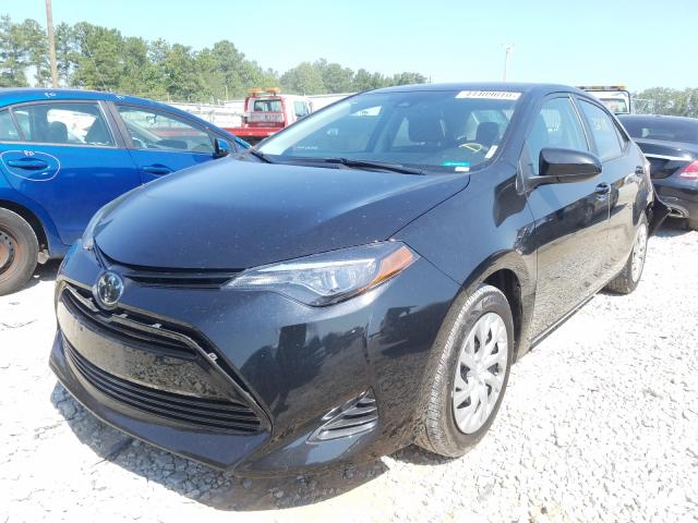 Photo 1 VIN: 5YFBURHE3KP912390 - TOYOTA COROLLA L 