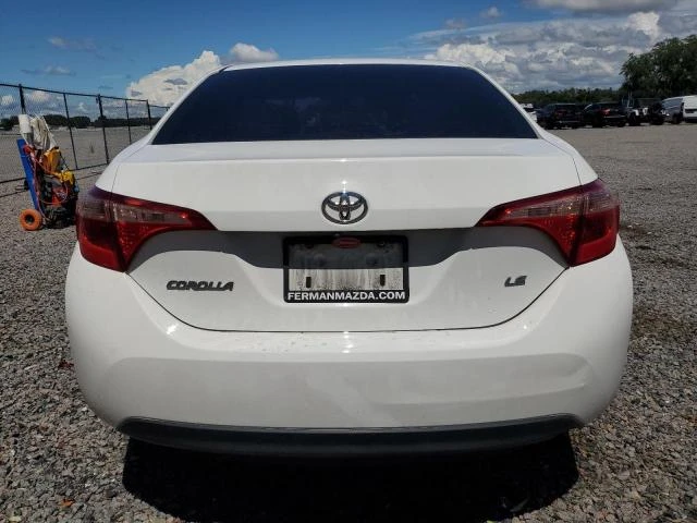 Photo 5 VIN: 5YFBURHE3KP948449 - TOYOTA COROLLA L 