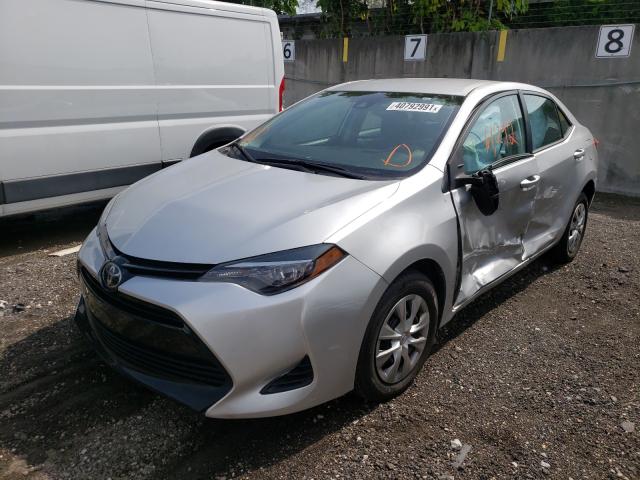 Photo 1 VIN: 5YFBURHE4JP740210 - TOYOTA COROLLA L 