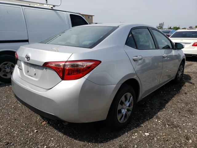 Photo 3 VIN: 5YFBURHE4JP740210 - TOYOTA COROLLA L 