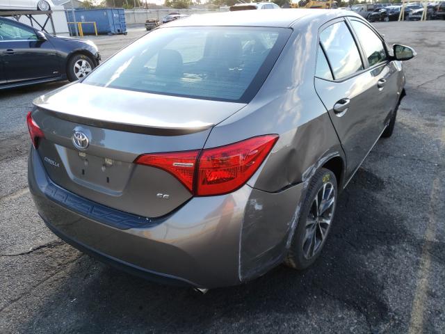 Photo 3 VIN: 5YFBURHE4JP748243 - TOYOTA COROLLA L 