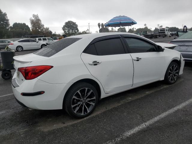 Photo 2 VIN: 5YFBURHE4JP779427 - TOYOTA COROLLA L 