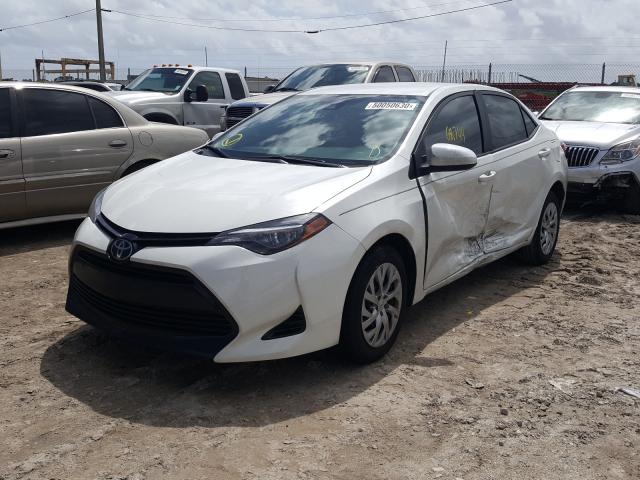 Photo 1 VIN: 5YFBURHE4JP818209 - TOYOTA COROLLA L 