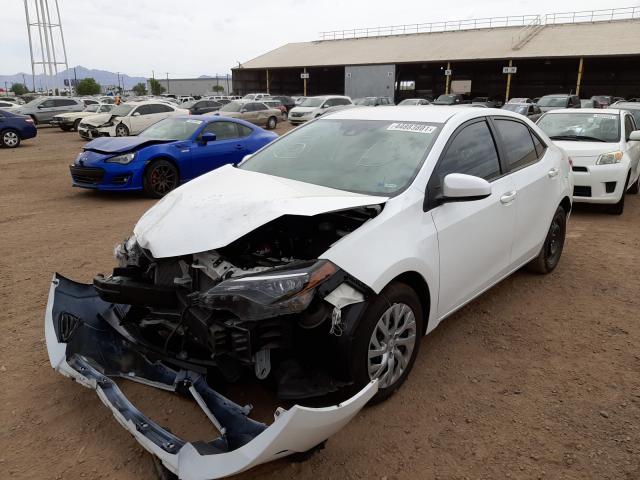 Photo 1 VIN: 5YFBURHE4KP858159 - TOYOTA COROLLA L 