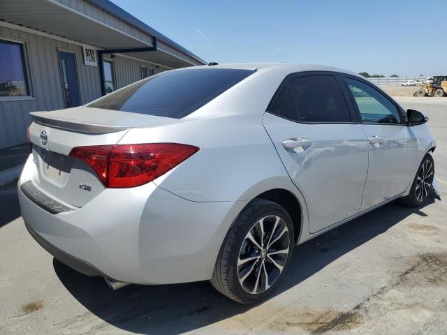 Photo 2 VIN: 5YFBURHE4KP869498 - TOYOTA COROLLA L 