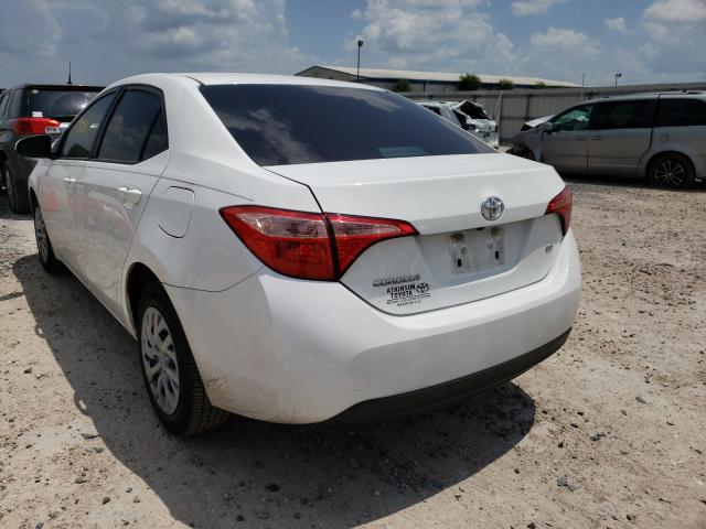 Photo 2 VIN: 5YFBURHE4KP882638 - TOYOTA COROLLA L 