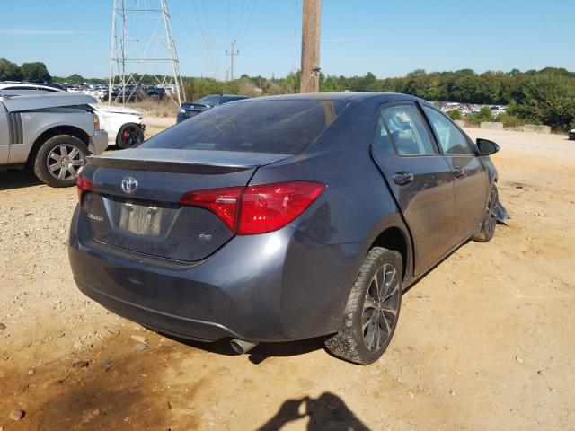 Photo 3 VIN: 5YFBURHE5HP608843 - TOYOTA COROLLA L 