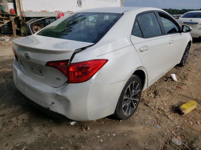 Photo 3 VIN: 5YFBURHE5HP613413 - TOYOTA COROLLA L 