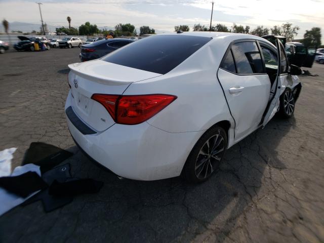 Photo 3 VIN: 5YFBURHE5HP667925 - TOYOTA COROLLA L 