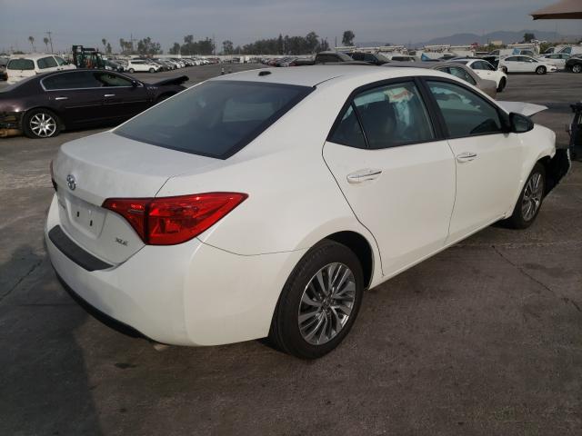 Photo 3 VIN: 5YFBURHE5KP868084 - TOYOTA COROLLA 