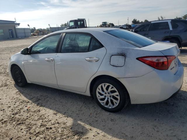 Photo 1 VIN: 5YFBURHE5KP869185 - TOYOTA COROLLA L 