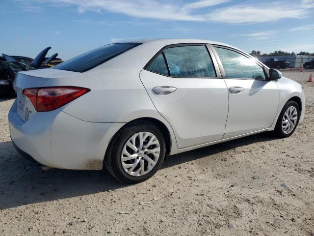 Photo 2 VIN: 5YFBURHE5KP869185 - TOYOTA COROLLA L 