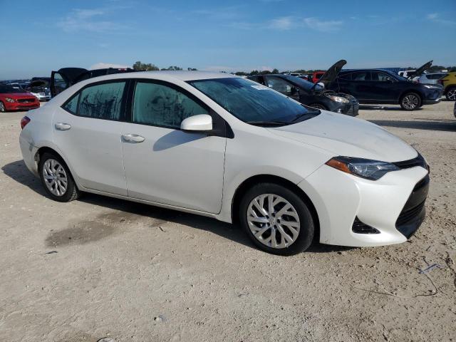 Photo 3 VIN: 5YFBURHE5KP869185 - TOYOTA COROLLA L 